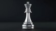 © Sadix - 3D render of a chrome chess king isolated against a dark background.