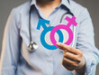 © meeboonstudio - Medical professional showing sex icons for gender awareness, identity, and health care.