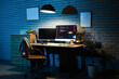 © Pixel-Shot - Interior of dark programmer's office with workplace and glowing lamp