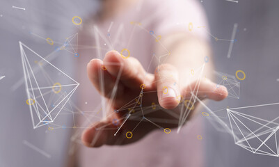 Abstract image of a hand interacting with a digital network. Represents connection, technology, and innovation.