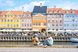 Vibrant canals of Copenhagen Denmark bustling with life and colorful architecture