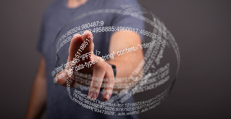 A hand interacts with a digital sphere of code, representing data and technology.