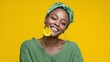 © Trushchenko_O - Woman is smiling and holding a yellow flower