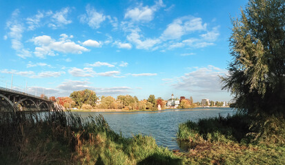 Wall Mural - beautiful view of a river with a bridge in the background