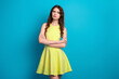 © deagreez - Modern fashion portrait of stylish young woman in yellow dress on blue background with confident pose