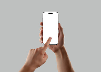 Wall Mural - man hand holding smartphone with blank screen and finger touch gesture on gray background. perfect m