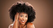© peopleimages.com - Hair, happy and portrait of black woman in studio for health, texture and growth on brown background. Salon, mockup space and person with natural hairstyle, afro and beauty for wellness and grooming