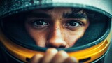 Close-up shot of a race car driver looking intensely through their helmet, capturing determination.