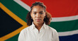 © peopleimages.com - Portrait, woman and South African flag for national pride, heritage and culture with support. Face, person and country banner for loyalty, patriotism and symbol for democracy with confident citizen