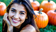 © Maikel - Beautiful young woman in Halloween costume with decorative pumpkins in the background