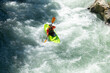 © ADDICTIVE STOCK - Kayaker navigating through rapid river waters