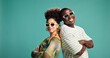 © peopleimages.com - Fashion, arms crossed and portrait of couple in studio for style, sunglasses and support. Happiness, relationship and clothes pride with African man and woman on green background for love and space
