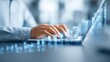 © mila103 - A professional is typing on a laptop while visual representations of data trends and analytics emerge on the screen, showcasing the integration of technology in business operations.