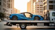 © Dmitry - Blue sport car with significant damage on a tow truck. Road accident in urban setting during golden hour. Automotive transport recovery service.