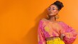© Harry - Stylish African American Woman Trendy Summer Fashion Vibrant Orange Background Casual Chic Outfit Pink Blouse Yellow Pants Bold Earrings Modern Style Summer Lookbook Beautiful