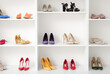 © Pixel-Shot - Shelves with different female shoes in boutique