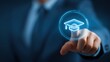 © Ployker - Businessman touching a virtual screen with a graduation hat icon, representing the concept of online education and e-learning technology