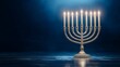 © Atmospheric stock - Illuminated menorah on reflective surface with blue background