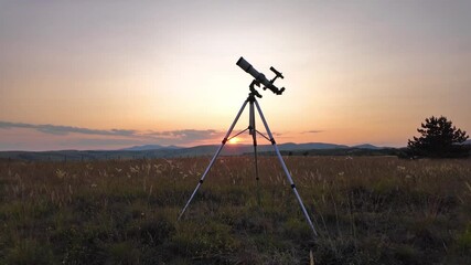 Wall Mural - Preparing for night sky observing with a astronomical telescope just before sunset in the countryside.