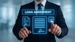 © AiDesign - Businessman with loan agreement screen processing online loan application showing digital finance approval and banking technology