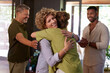 © Rido - People hugging after a wellness retreat experience