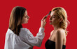© Yevhen - Process of making makeup. Make-up artist working with brush on model face. Applying tone to skin. Beautiful woman face. Hand of visagiste, painting cosmetics beauty model girl . Make up in process