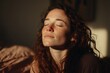 © LimeSky - Image of a spiritual woman seated on a bed with her eyes shut