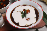 a bowl of biji salak porridge