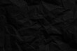 © banjongseal324 - Background of black crumpled paper close up macro,black crumpled paper texture pattern