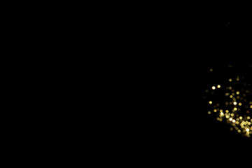 Wall Mural - golden blurred bokeh lights on black background