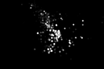 Wall Mural - white gray blurred bokeh lights on black background