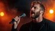 © svastix - A passionate male singer performing energetically on a dimly lit stage, highlighting the power of music to evoke emotions and connect with an enthusiastic audience.