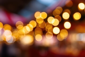 Wall Mural - Blurred holiday market lights background with warm colors