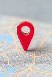 Red pin on map, location marker, navigation tool. Symbol of place, destination, and point of interest. Close up for focus.