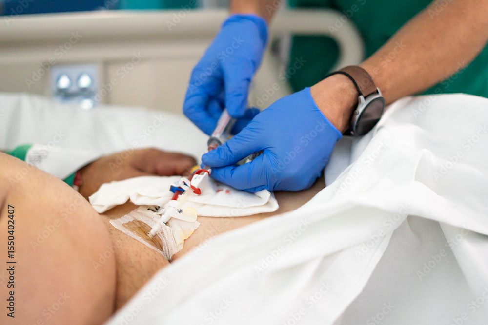 Doctor injecting medicine into central venous catheter of patient in ...