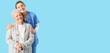 © Pixel-Shot - Nurse hugging senior woman on blue background with space for text