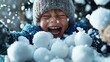© svastix - A cheerful young boy is joyfully playing in the snow, throwing snowballs and laughing, capturing the essence of childhood happiness and the joys of winter outings.