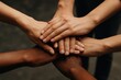 © Алена Ваторина - Diverse hands of different skin tones are stacked together in a collaborative gesture, symbolizing unity, teamwork, and support in a creative and inspiring environment