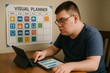 © Татьяна Евдокимова - Young man with autism spectrum disorder using visual planner and tablet to manage daily schedule, promoting independence and organization