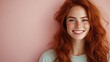 © svastix - A joyful young woman with striking red hair and freckles smiles warmly against a soft pink background, exuding confidence and positivity in her expression.
