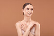 © New Africa - Portrait of beautiful young woman on beige background