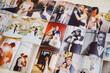 © andrey - Printed wedding photos laid out on a wooden surface.