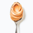 © Aqsapics - a spoon filled with smooth peanut butter