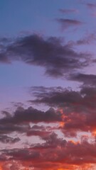 Wall Mural - Sunlight Shining Through Clouds. 4k Sunset Time Lapse Time-lapse In Yellow, Orange, Pink Colors. Fiery Sunset Clouds Sky. Sunrays, Sunray, Ray, Dramatic Sky. Sunset Sky Natural Background. Dusk Of Day