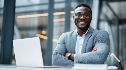 Wall Mural - business leader with confident smile sitting beside blank-screen laptop in office, space for adverti