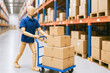 © tonstock - Efficiency and logistics coordination drive success as inventory is managed and moved with steady focus in a busy warehouse