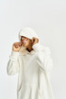 © LIGHTFIELD STUDIOS - Stylish little boy in cheerful outfit enjoying playful moments with a big smile