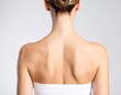 © AiMaball - Realistic back view of a female torso showcasing visible shoulder blades and smooth skin, bathed in soft natural light against an isolated background.