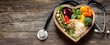 © Marta B - The heart-shaped bowl filled with fresh fruits and vegetables showcasing healthy eating.