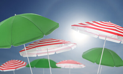 Wall Mural - different bright beach umbrellas against blue sky on sunny day
